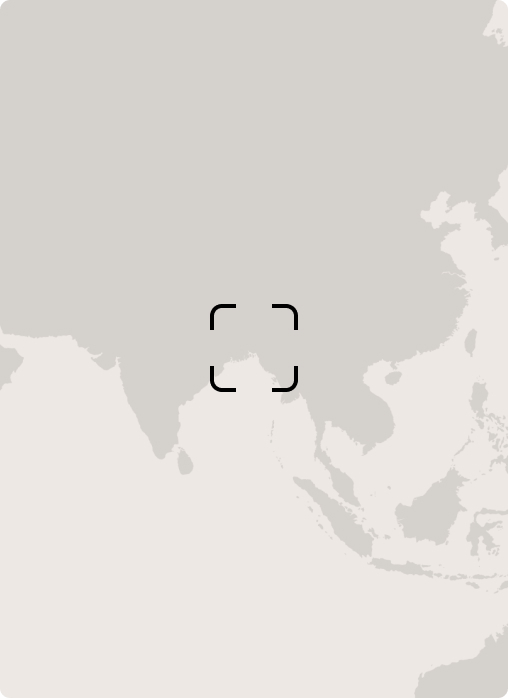Satellite map vignette focusing on Asia, with a centered target reticle over the region around Southeast Asia and the South China Sea, mostly beige tones.