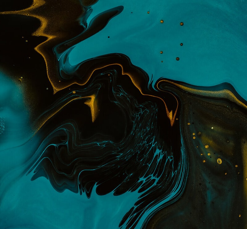 Intricate abstract swirl of teal, black, and gold with fluid, marbled patterns and small gold specks scattered across the surface.
