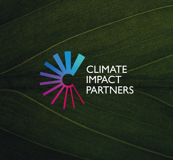 LOGO with colorful circular gradient rays forming a partial sun beside the text “CLIMATE IMPACT PARTNERS” on a dark green leaf background.