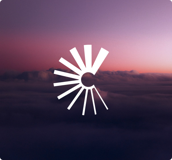Circular white logo with radial spikes over a purple-pink sunset above dark clouds, centered on the horizon.